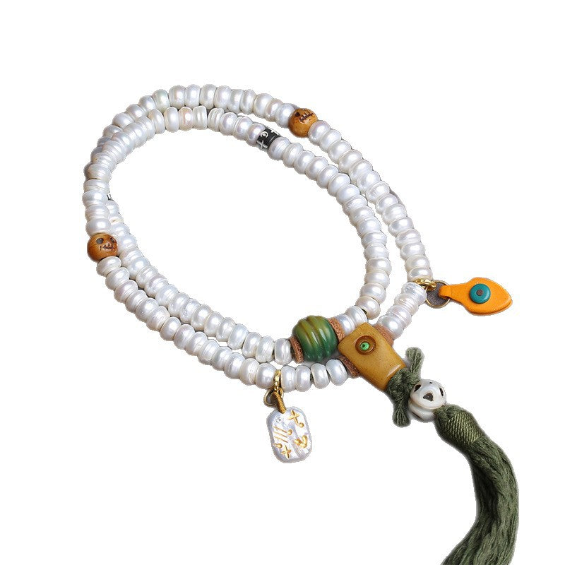Supplier photo of the pearl-white 108 mala with squared guru bead and dark green tassel on a white background