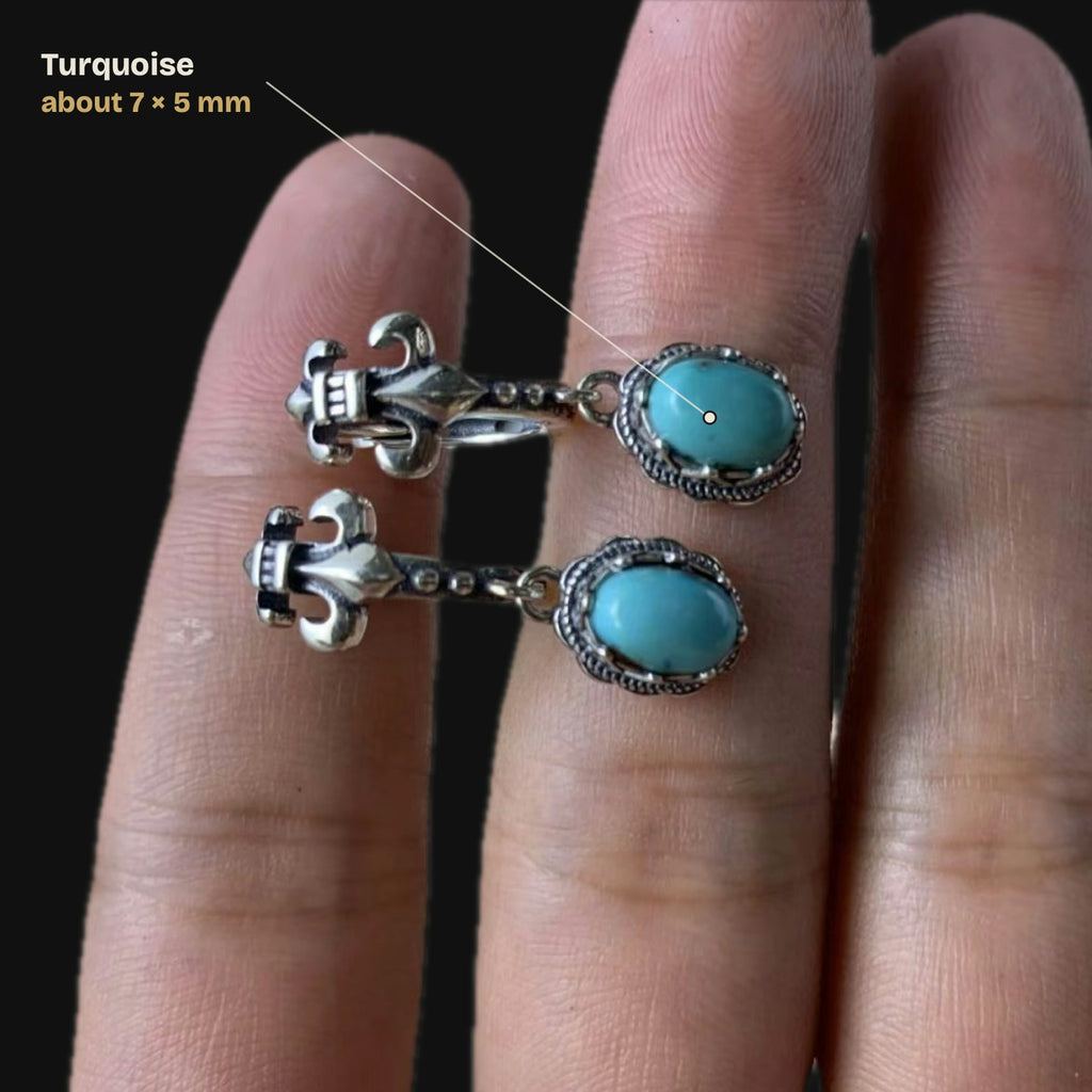 Size guide on a hand: oval turquoise about 7 × 5 mm