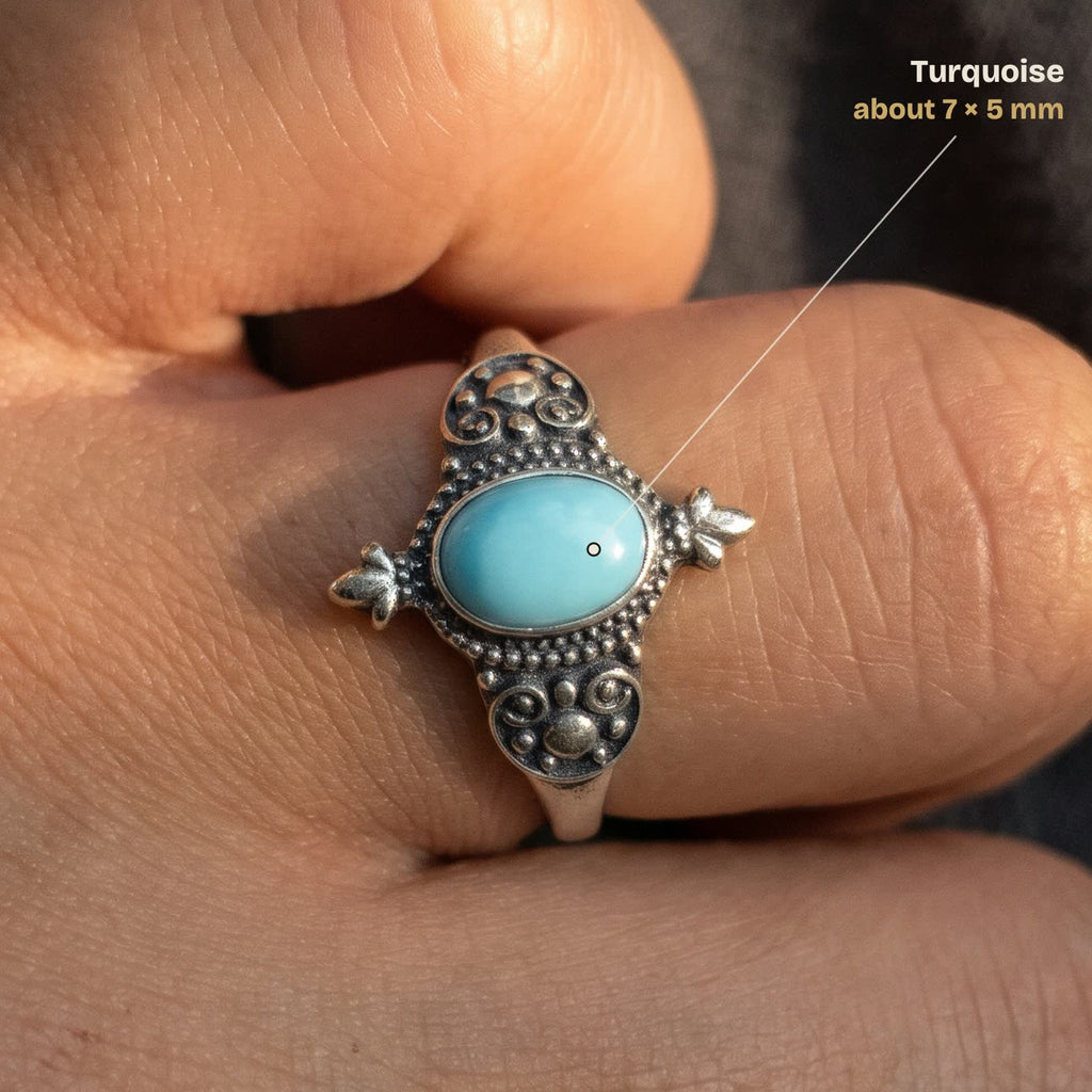 Size guide: oval turquoise about 7 × 5 mm, shown on a finger