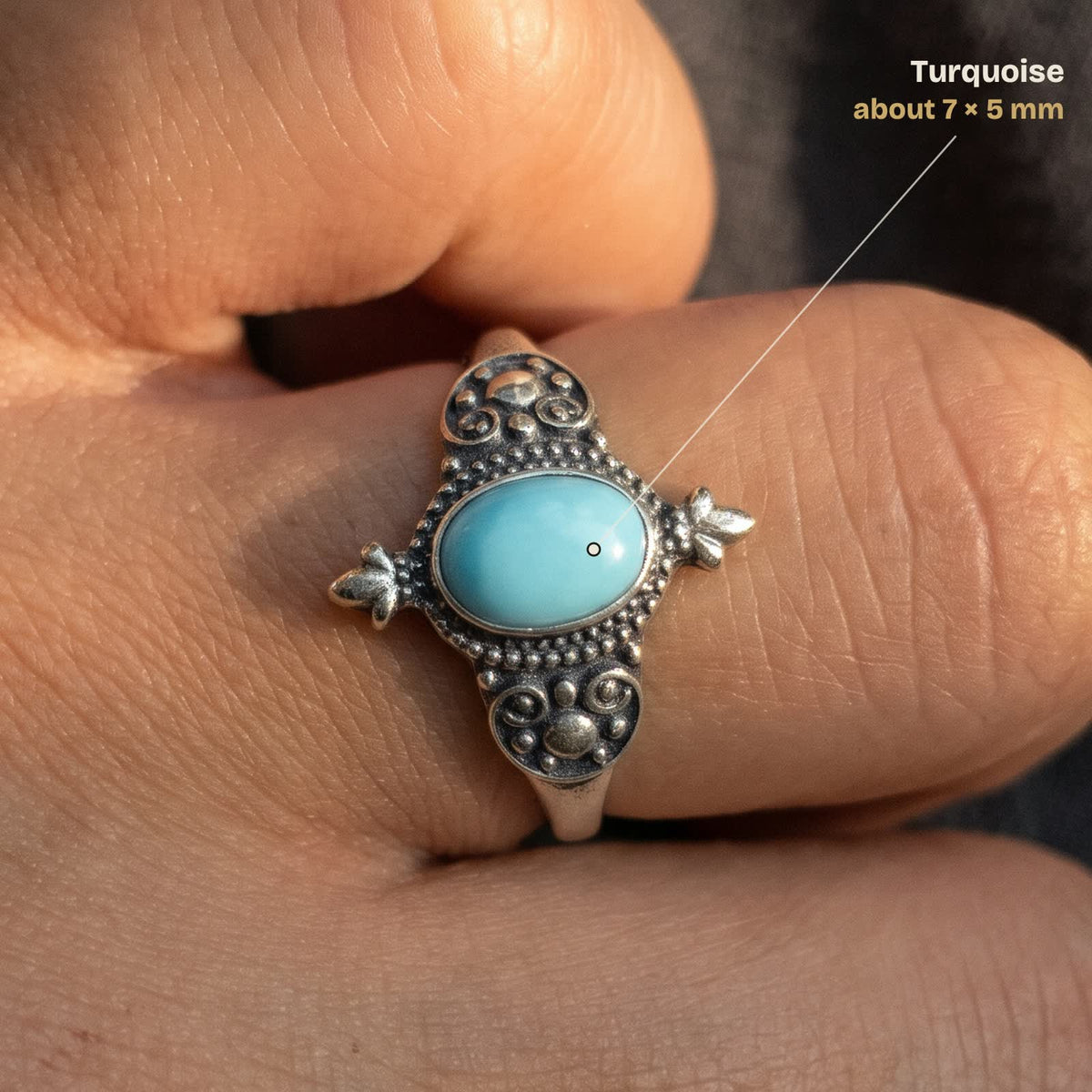 Size guide: oval turquoise about 7 × 5 mm, shown on a finger