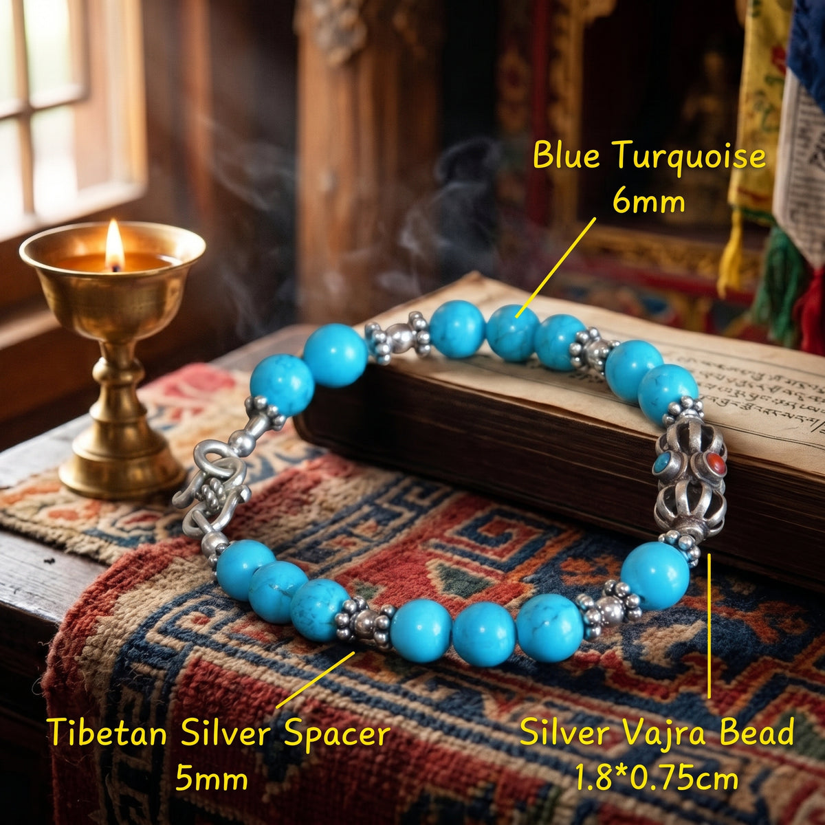 Labeled vajra bracelet on an old book: blue turquoise 6 mm, Tibetan silver spacer 5 mm, silver vajra 1.8 × 0.75 cm