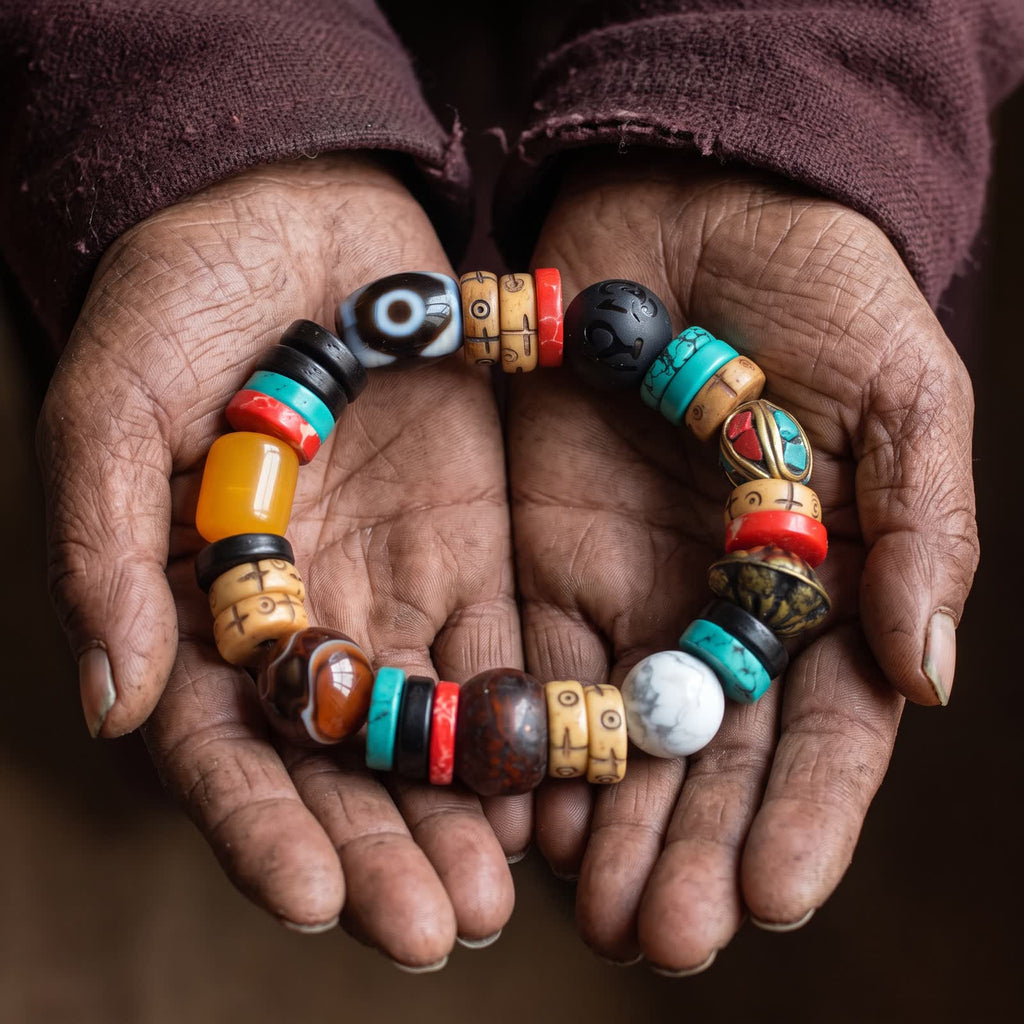 Elderly weathered hands holding the dzi and yak bone bracelet in cupped palms
