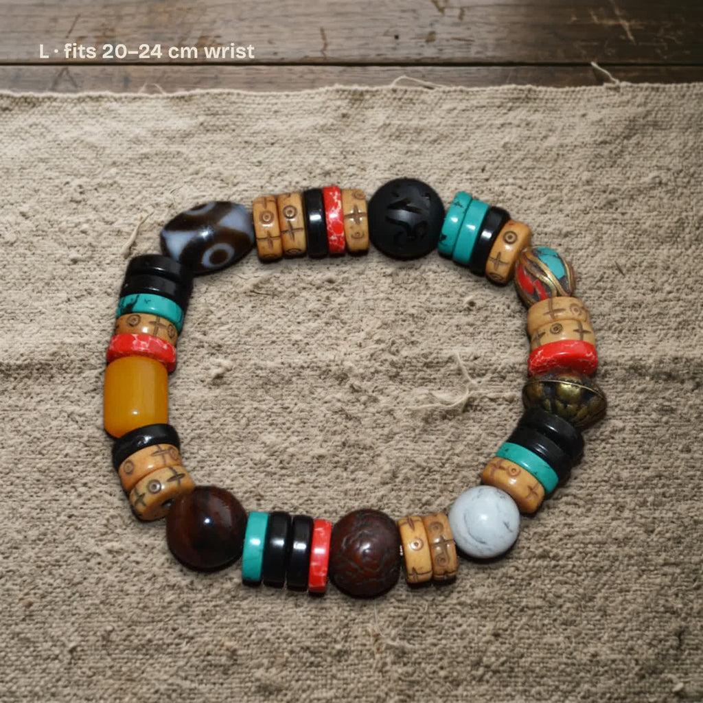 Size L dzi and carved yak bone bracelet on undyed wool, labelled fits 20–24 cm wrist