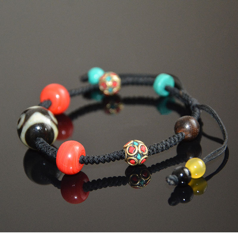 Supplier photo of the back of the braided-cord bracelet showing the sliding knot and cord-end beads